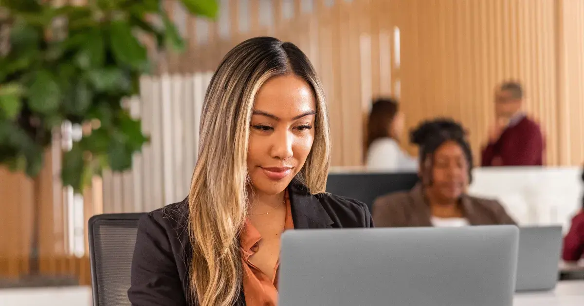 Banner image for an article on content calendar management. Shows a photograph of a woman in a business setting overlaid with illustrations of a content calendar.