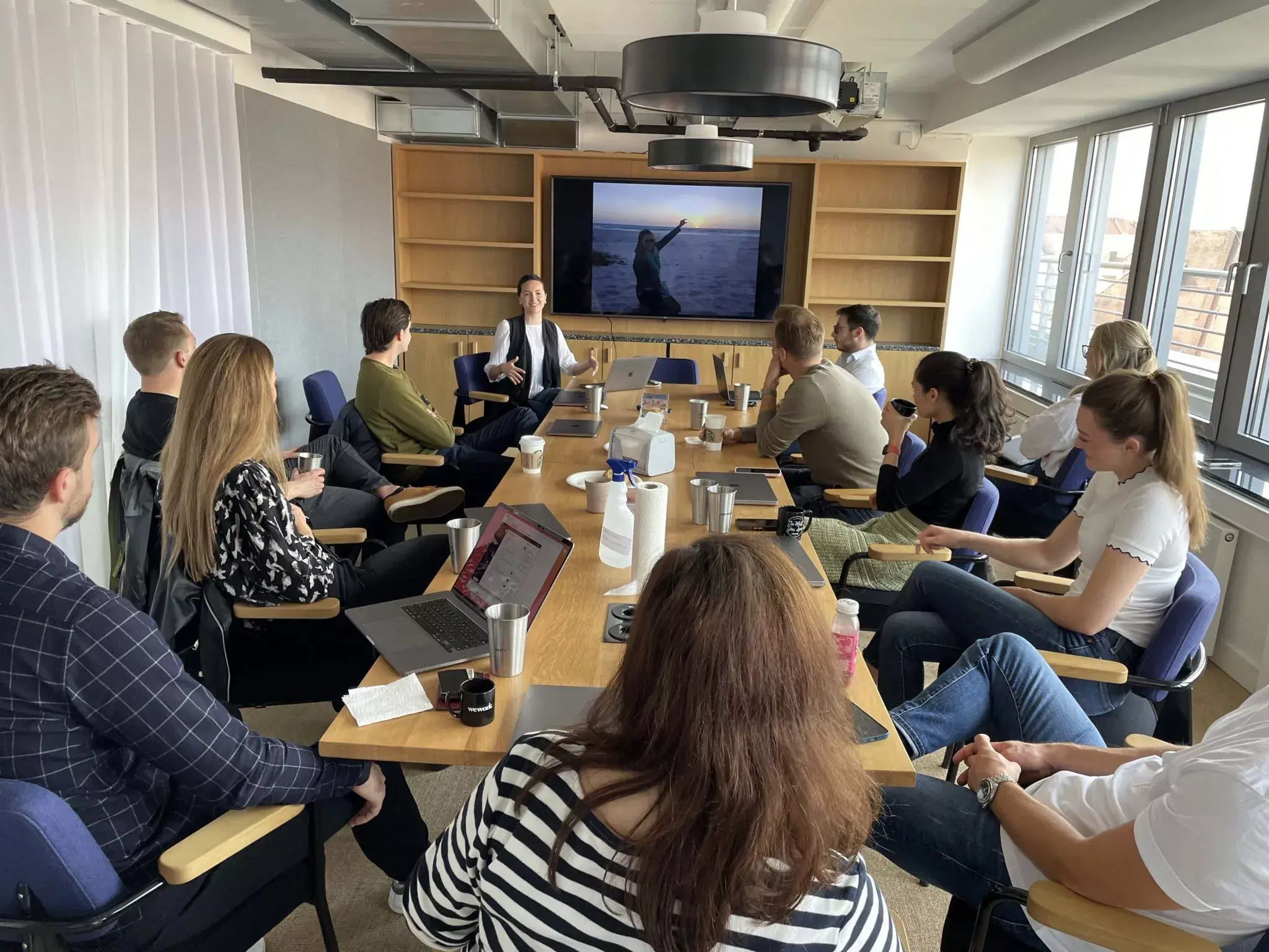 Members of the Asana team gather in the Munich office.