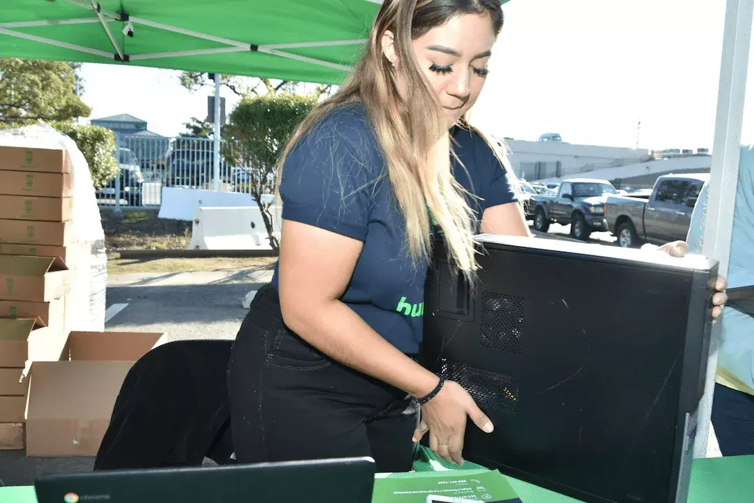 Image of Human-I-T Employee checking equipment