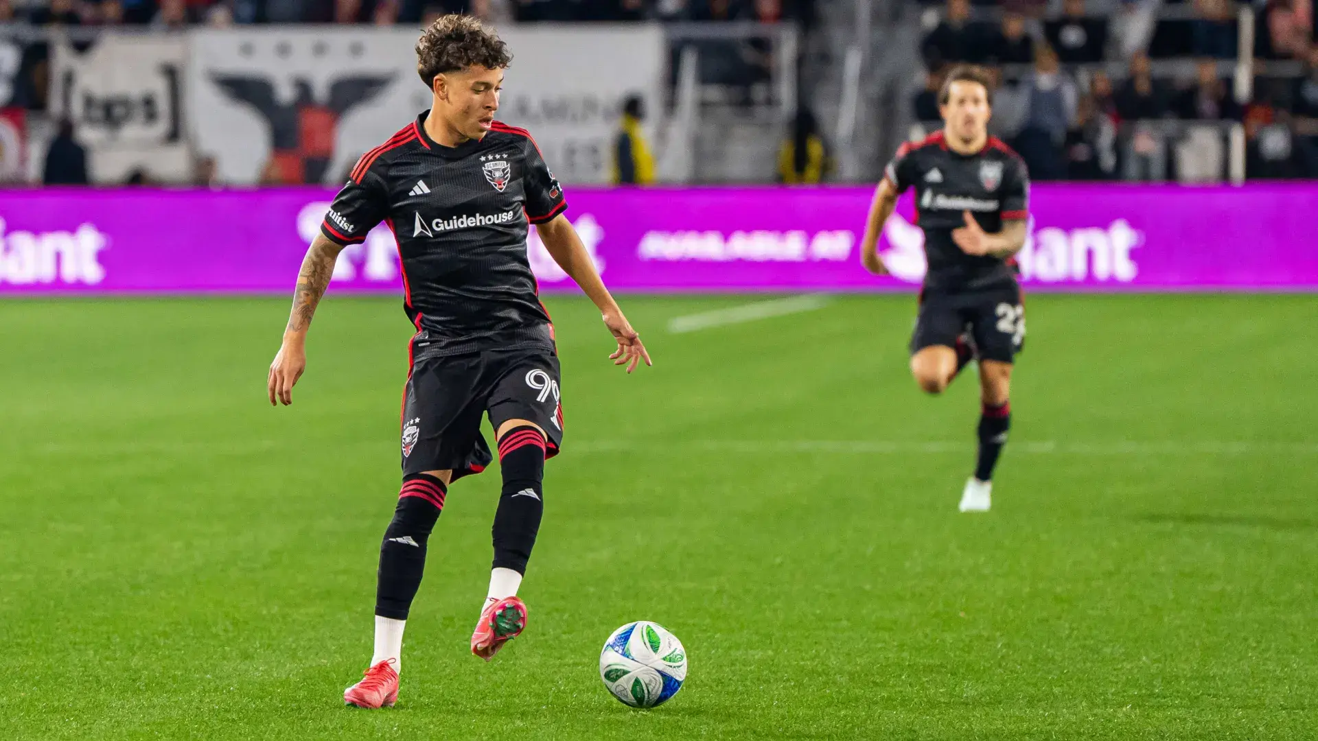 Image of soccer players on the pitch for a case study on how D.C. United uses Asana